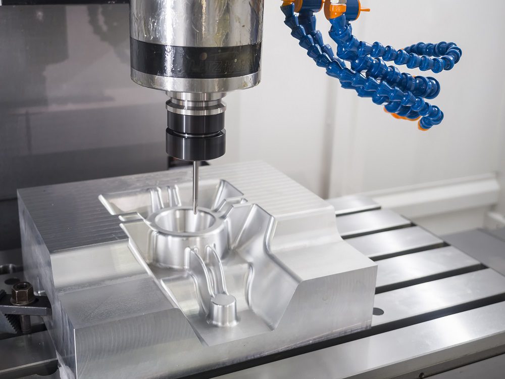 CNC milling is a subtractive manufacturing process where a workpiece remains stationary while a rotating cutting tool moves along various axes to remove material and shape the desired part.
