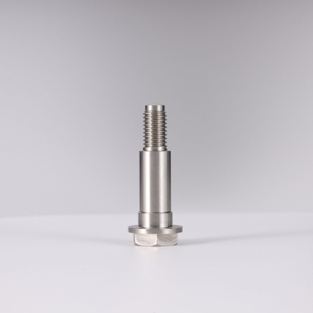 alt text showing a CNC machine actively cutting a stainless steel part